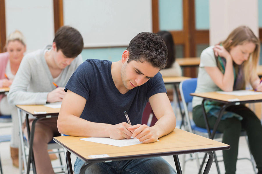 Students taking a test in a classroom in Kent